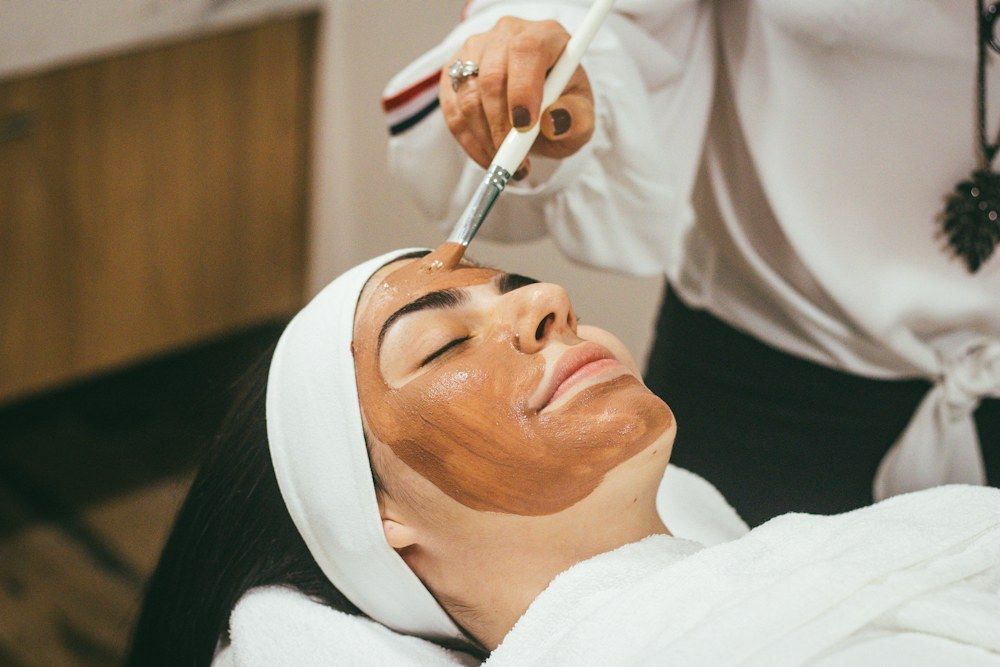 A peel being applied with a brush during treatment